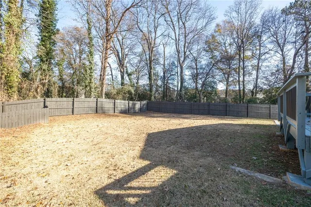 a view of yard with a trees