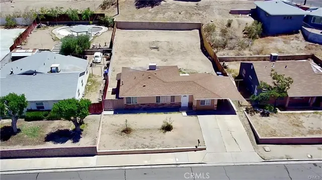 an aerial view of a house with a outdoor space