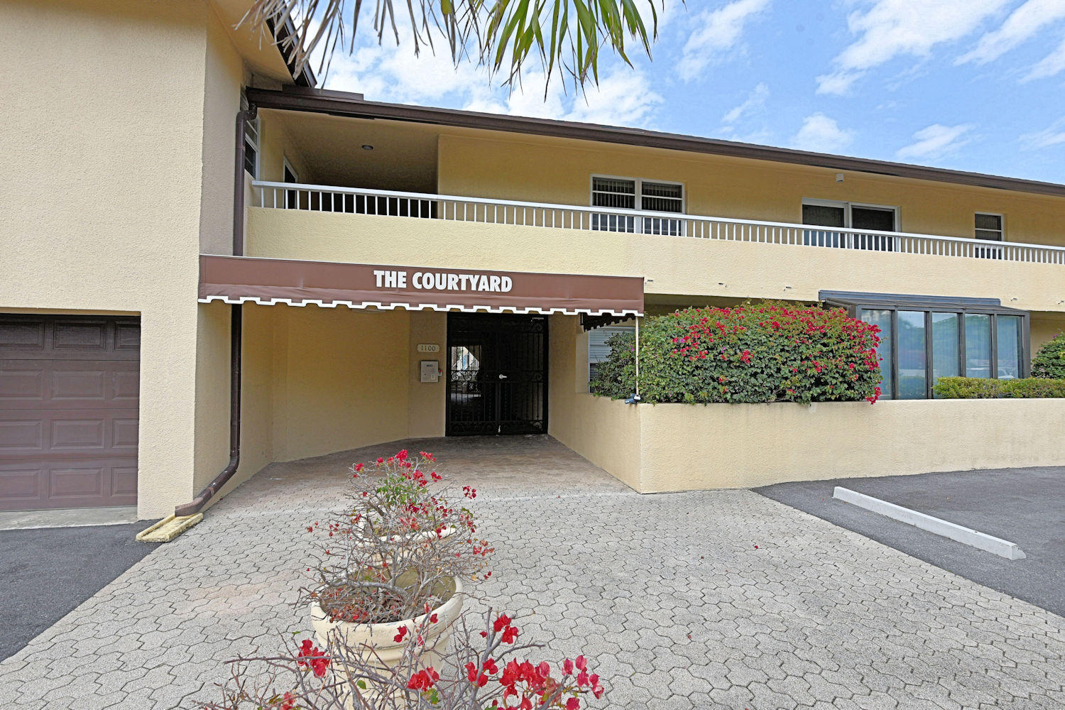 1100 Surf Road, Unit 216 Riviera Beach, FL 33404 - Photo 16 of 19 Main Entrance to The Courtyard