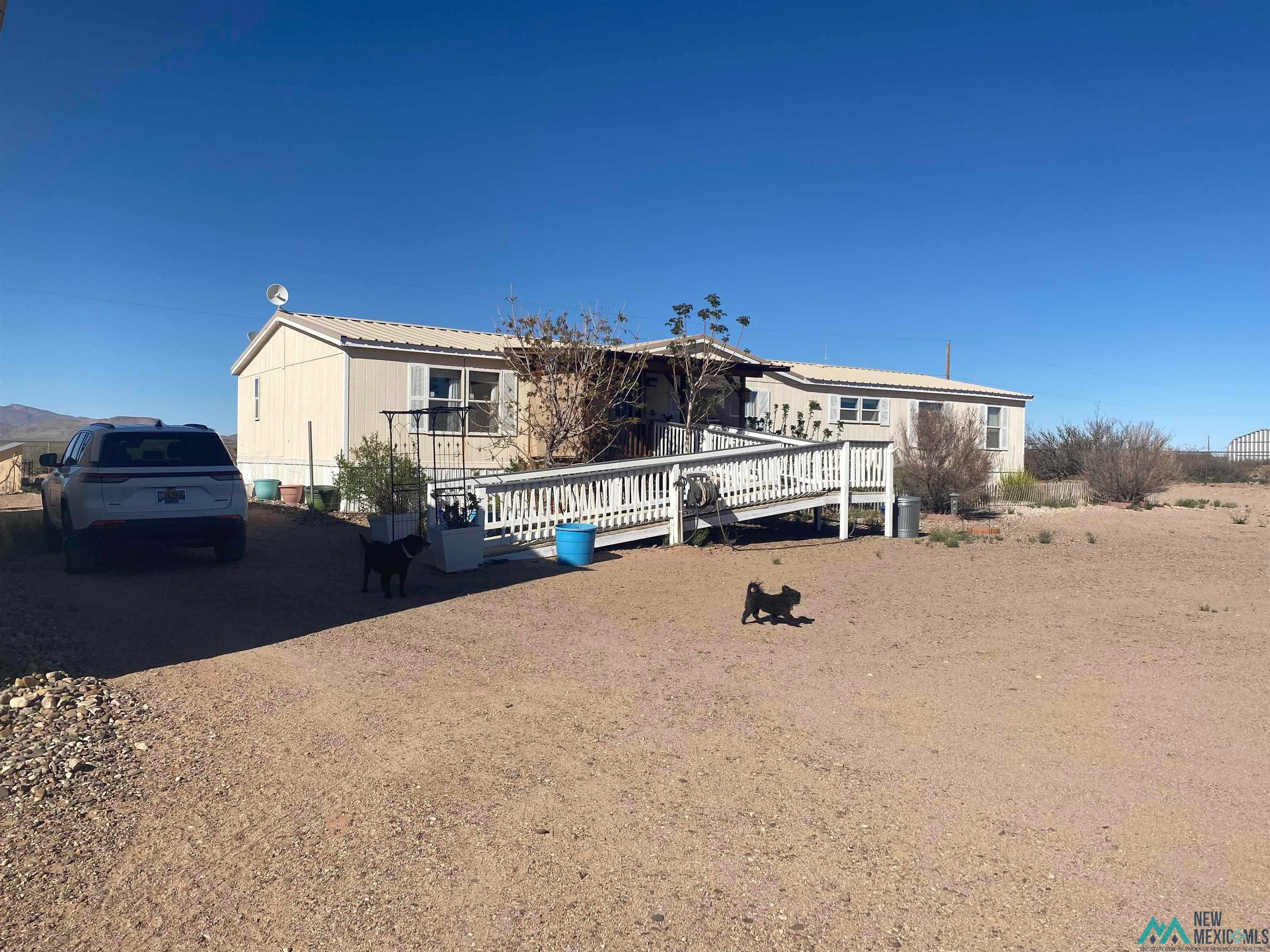465 Irritabe Road Northeast Deming, NM 88030 - Photo 6 of 24 Manufactured / mobile home featuring a wooden deck