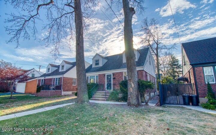 126 Goodwin Avenue Staten Island, NY 10314 - Photo 2 of 3 a view of a house with a yard