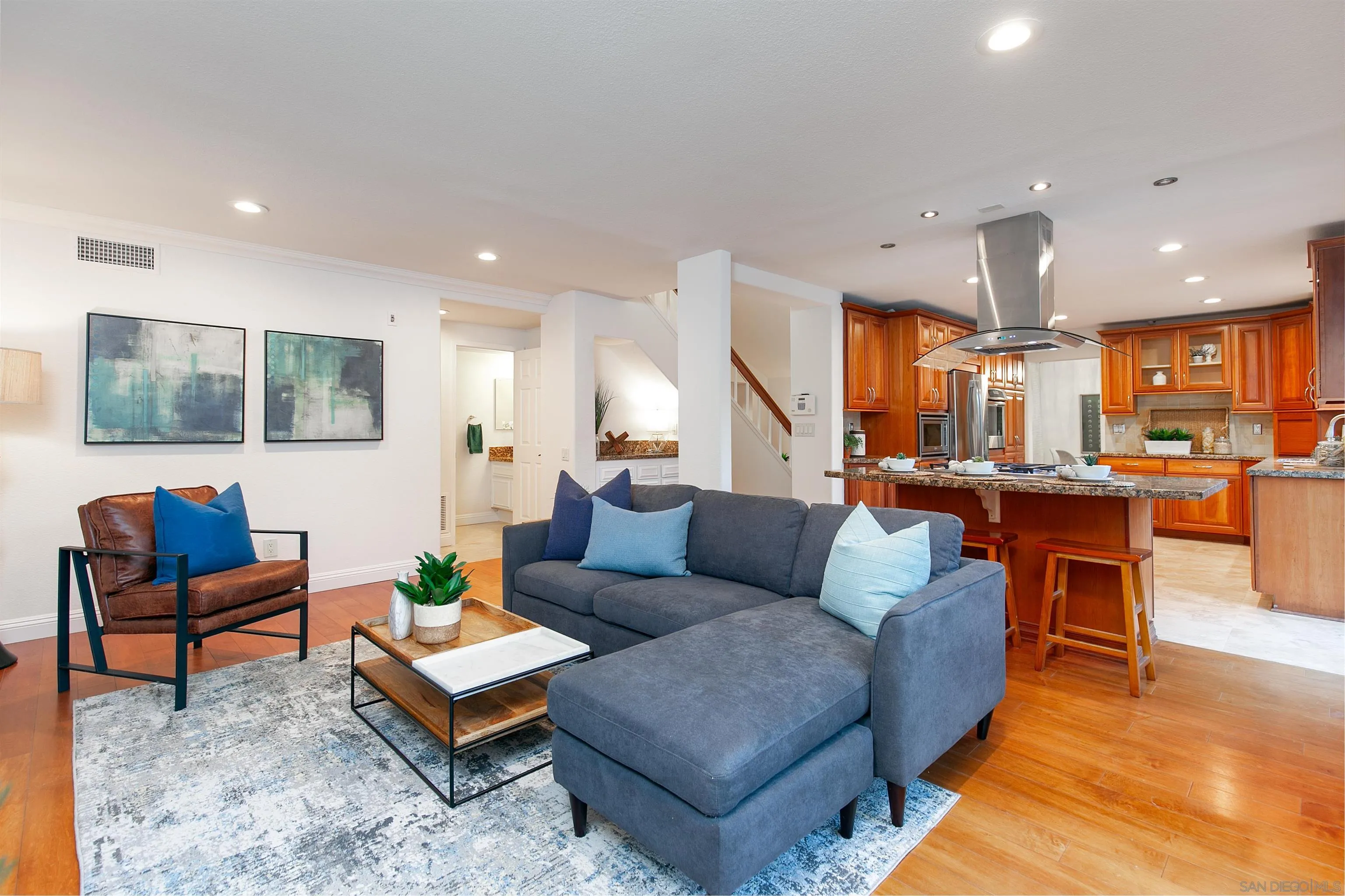 3245 Lower Ridge Road San Diego, CA 92130 - Photo 18 of 45 a living room with furniture kitchen view and a table