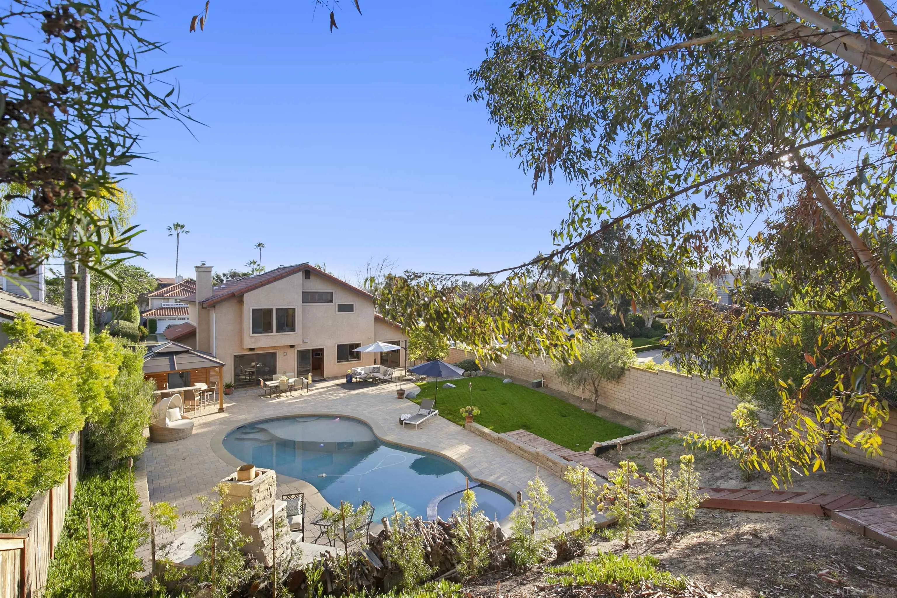 3245 Lower Ridge Road San Diego, CA 92130 - Photo 22 of 45 a view of a house with a yard