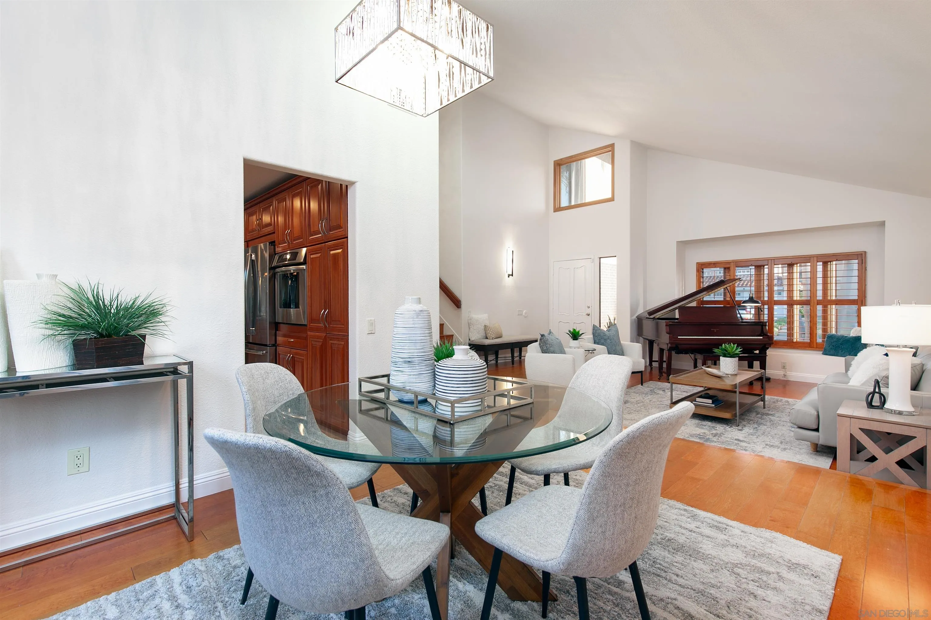 3245 Lower Ridge Road San Diego, CA 92130 - Photo 7 of 45 a view of a dining room with furniture window and wooden floor