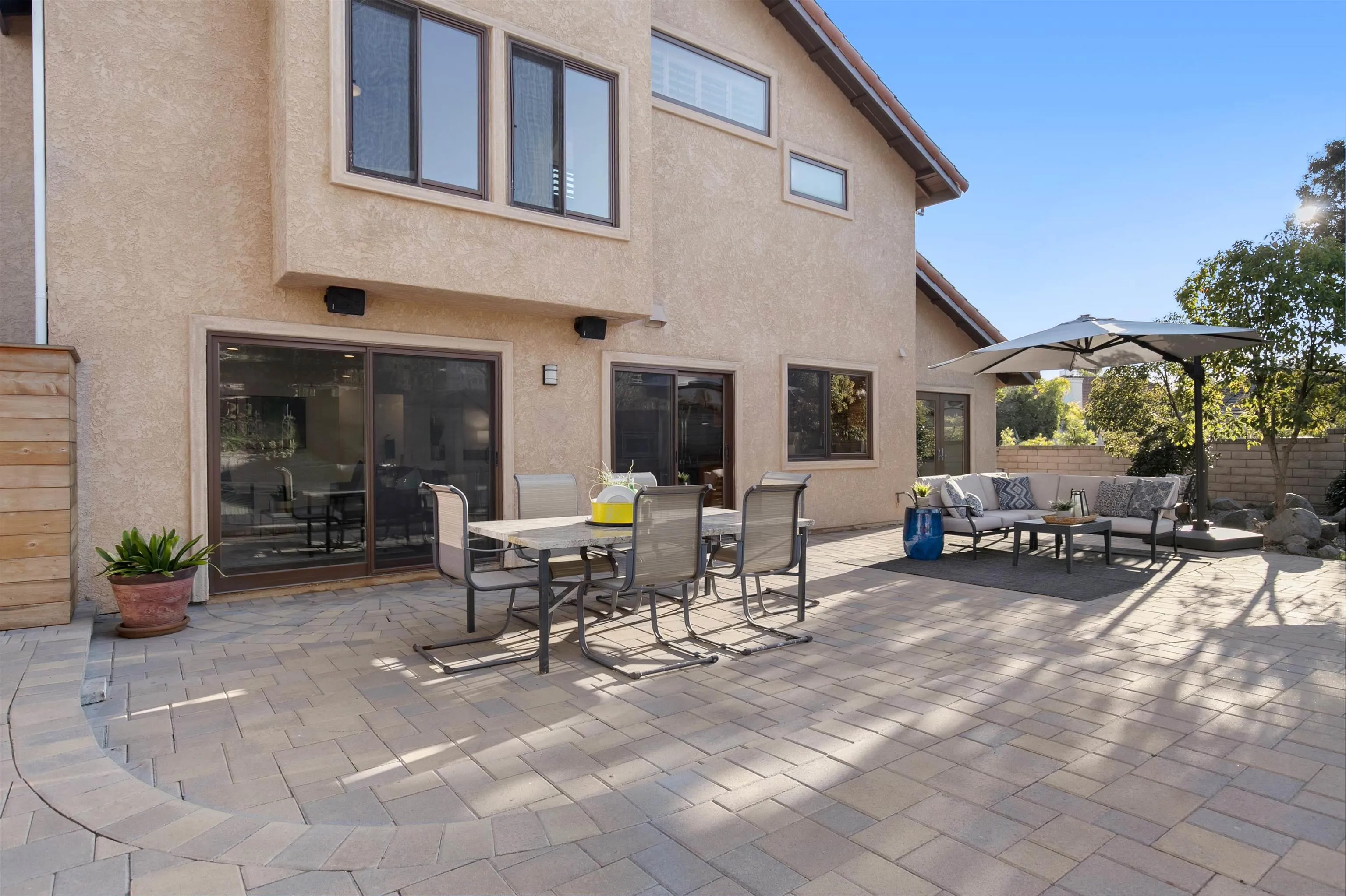 3245 Lower Ridge Road San Diego, CA 92130 - Photo 10 of 45 a view of a dinning table and chairs in the patio of the house
