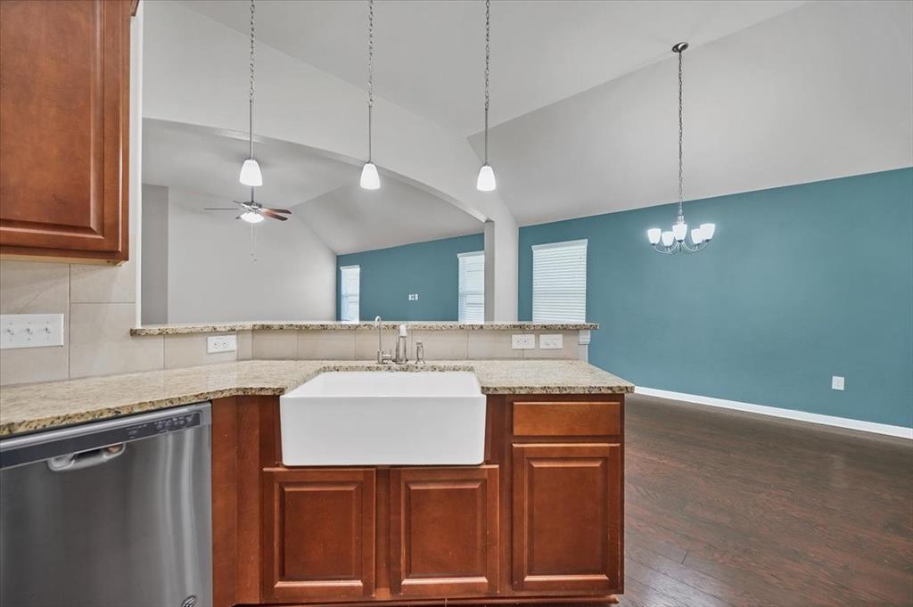 1909 Goldilocks Lane Manchaca, TX 78652 - Photo 10 of 27 a kitchen with a sink cabinets and wooden floor