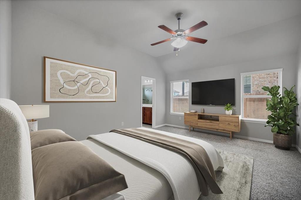 1909 Goldilocks Lane Manchaca, TX 78652 - Photo 13 of 27 a bedroom with a bed and a flat screen tv