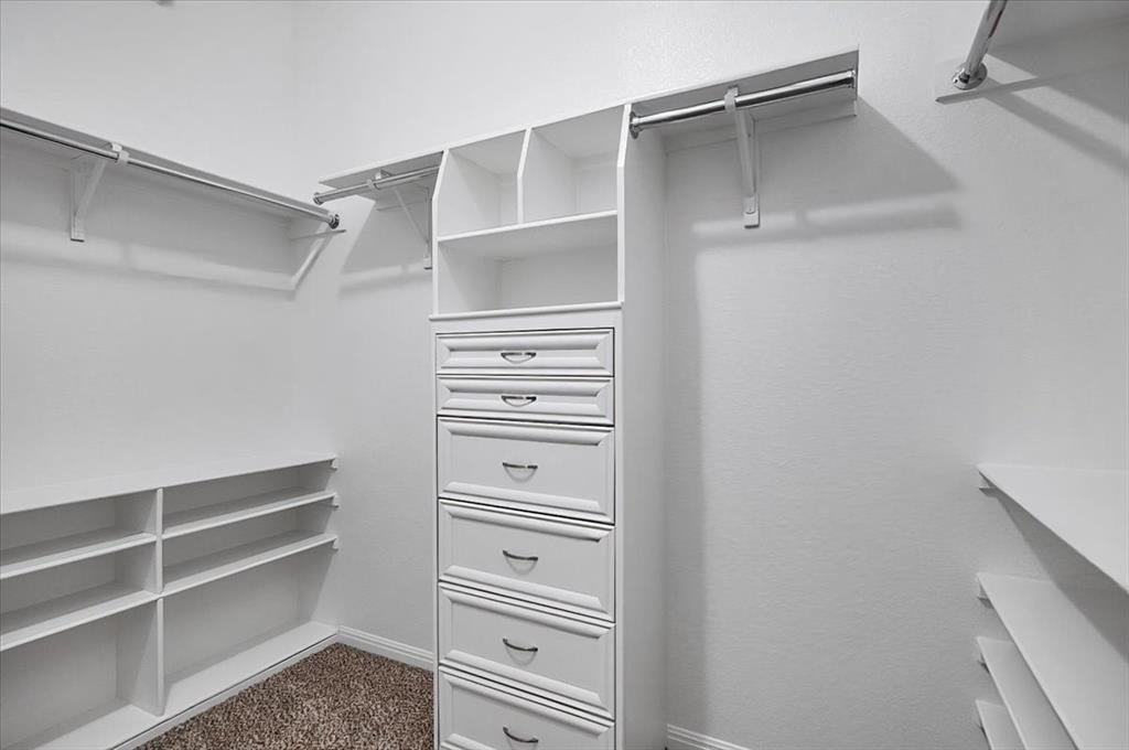1909 Goldilocks Lane Manchaca, TX 78652 - Photo 17 of 27 a view of walk in closet with empty racks