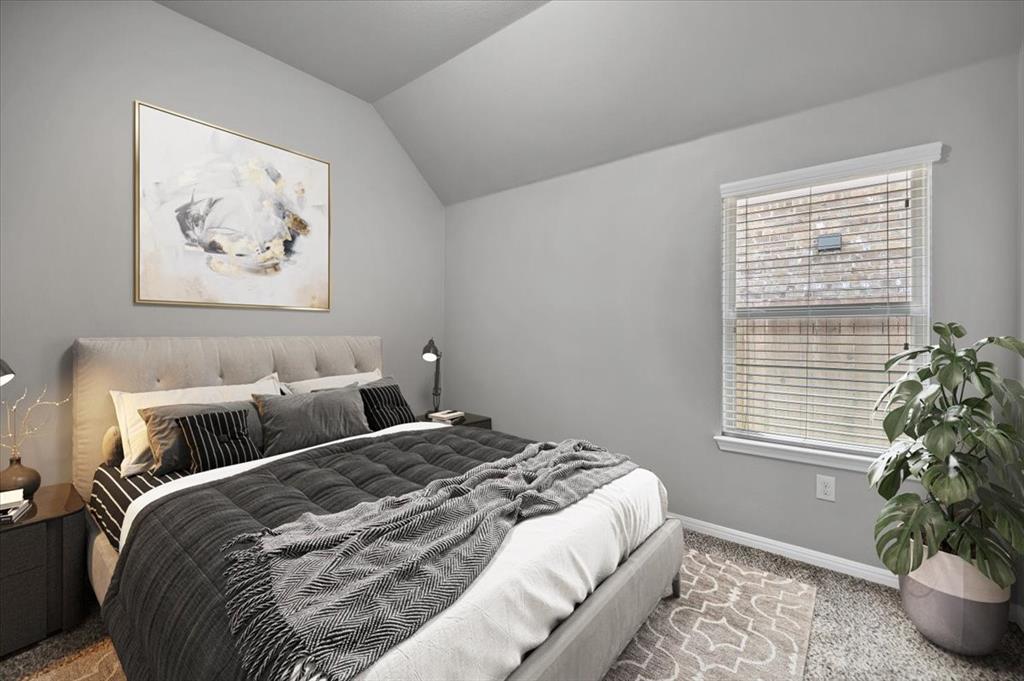 1909 Goldilocks Lane Manchaca, TX 78652 - Photo 18 of 27 a bedroom with a bed and a potted plant