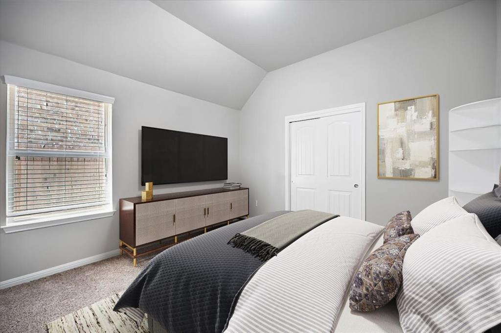 1909 Goldilocks Lane Manchaca, TX 78652 - Photo 20 of 27 a bedroom with a bed and a flat screen tv