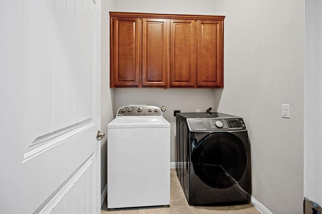 1909 Goldilocks Lane Manchaca, TX 78652 - Photo 25 of 27 a utility room with dryer and washer