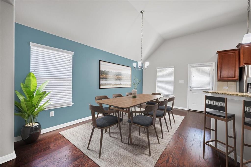 1909 Goldilocks Lane Manchaca, TX 78652 - Photo 5 of 27 a view of a dining room with furniture window and wooden floor