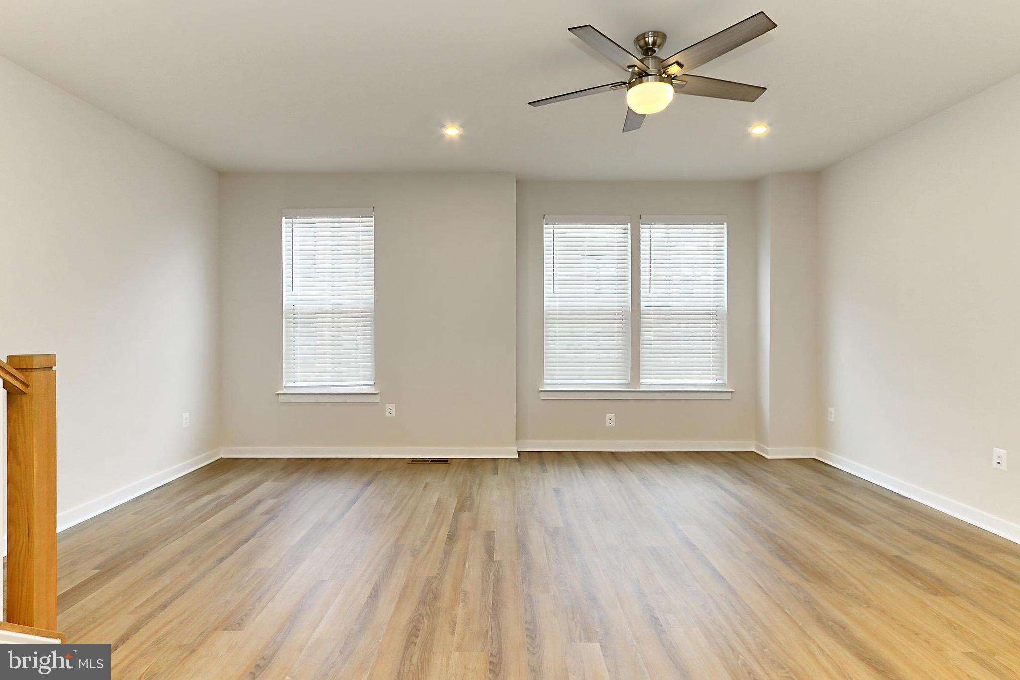 14176 Gypsum Loop Chantilly, VA 20151 - Photo 14 of 44 wooden floor in an empty room with a window