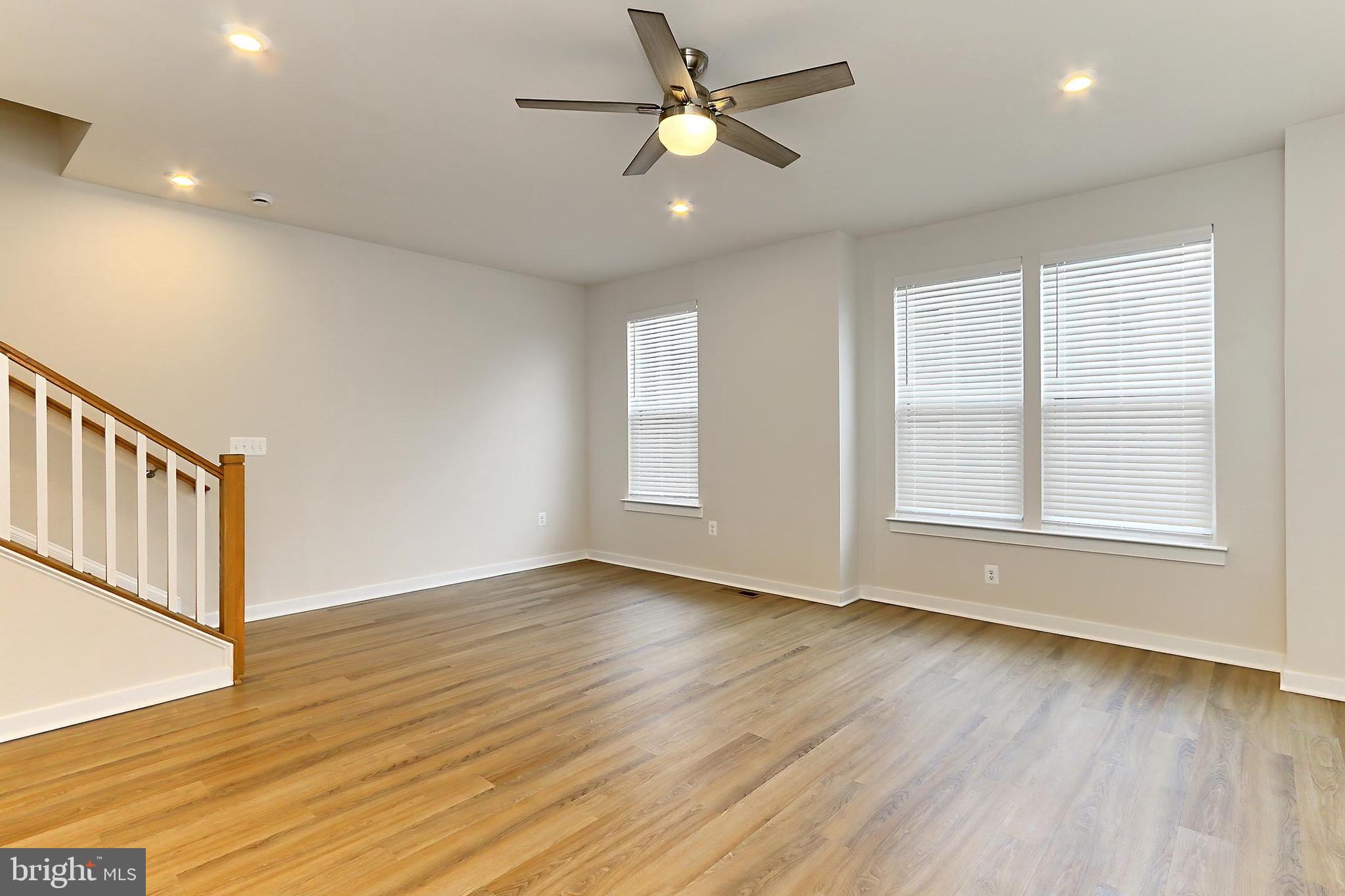14176 Gypsum Loop Chantilly, VA 20151 - Photo 15 of 44 a view of an empty room with window and wooden floor