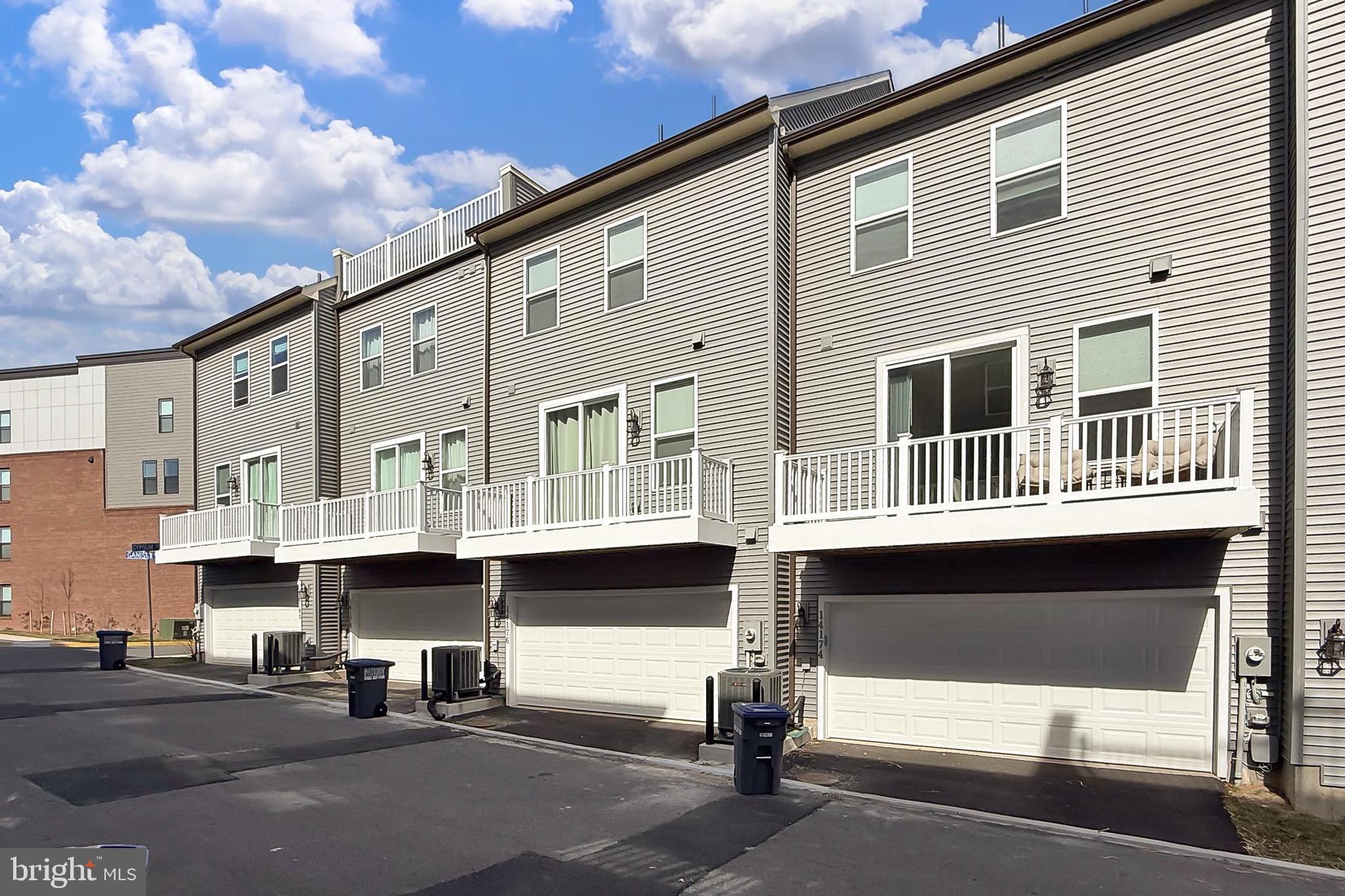 14176 Gypsum Loop Chantilly, VA 20151 - Photo 2 of 44 a front view of a building with street