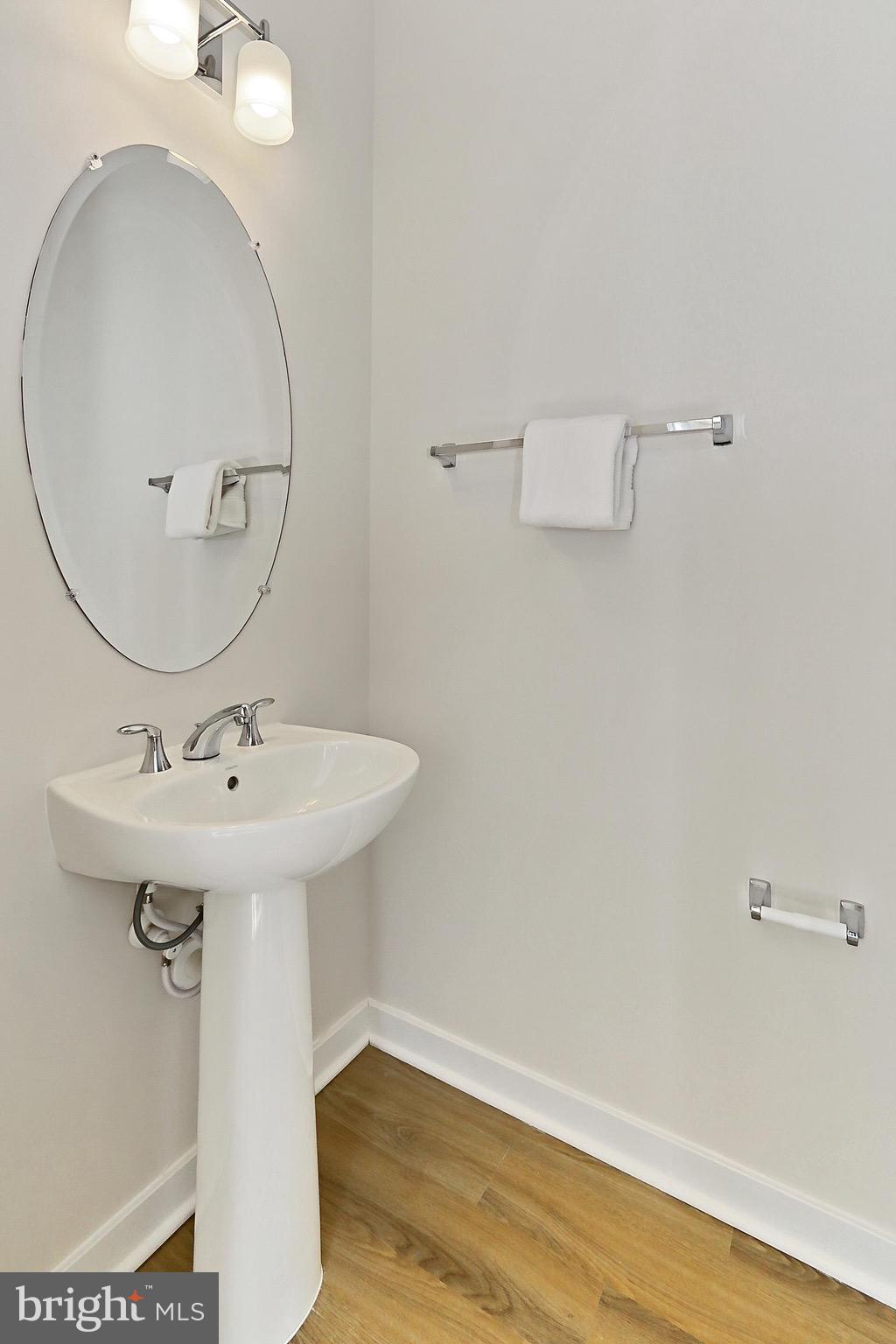 14176 Gypsum Loop Chantilly, VA 20151 - Photo 27 of 44 a bathroom with a sink and a mirror