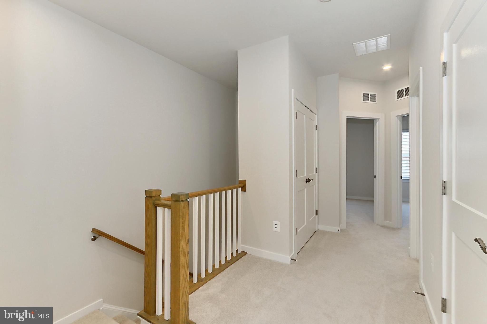 14176 Gypsum Loop Chantilly, VA 20151 - Photo 31 of 44 a view of a hallway with a door