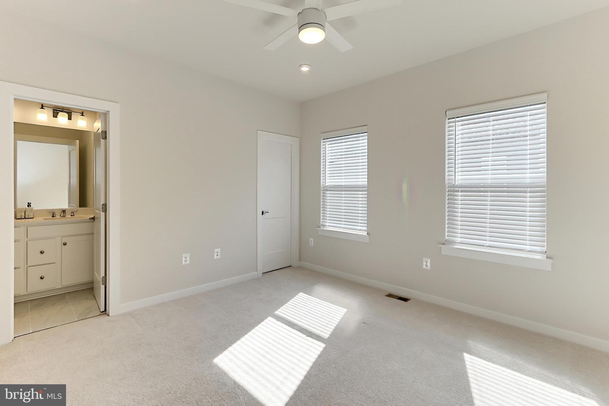 14176 Gypsum Loop Chantilly, VA 20151 - Photo 33 of 44 an empty room with windows and closet