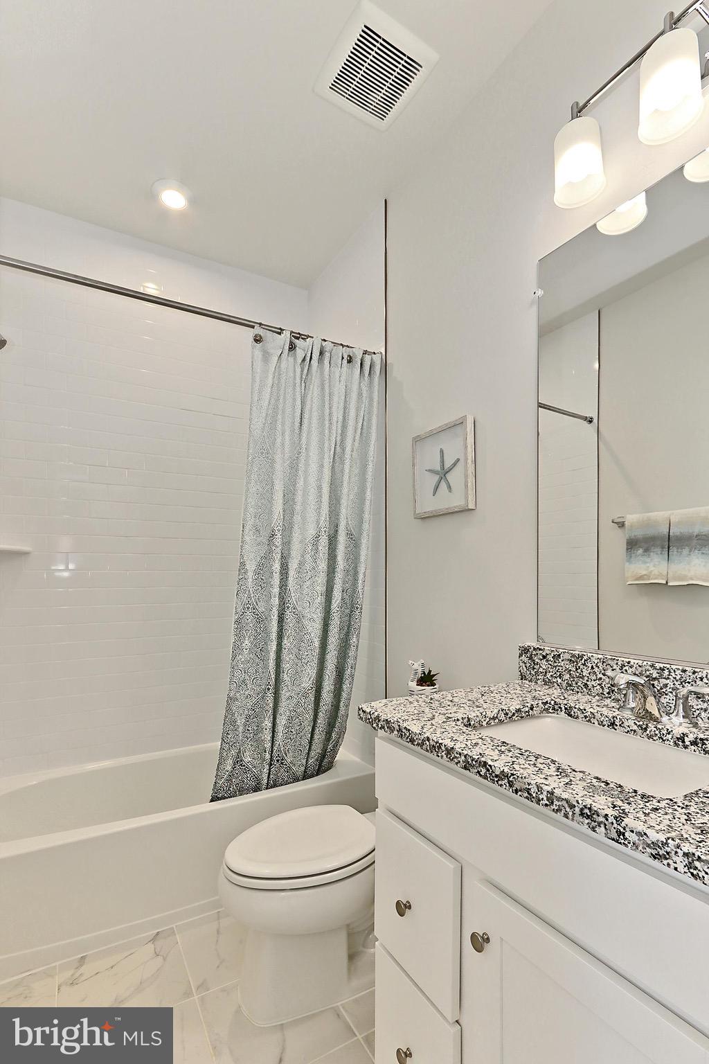 14176 Gypsum Loop Chantilly, VA 20151 - Photo 39 of 44 a bathroom with a granite countertop sink toilet and shower