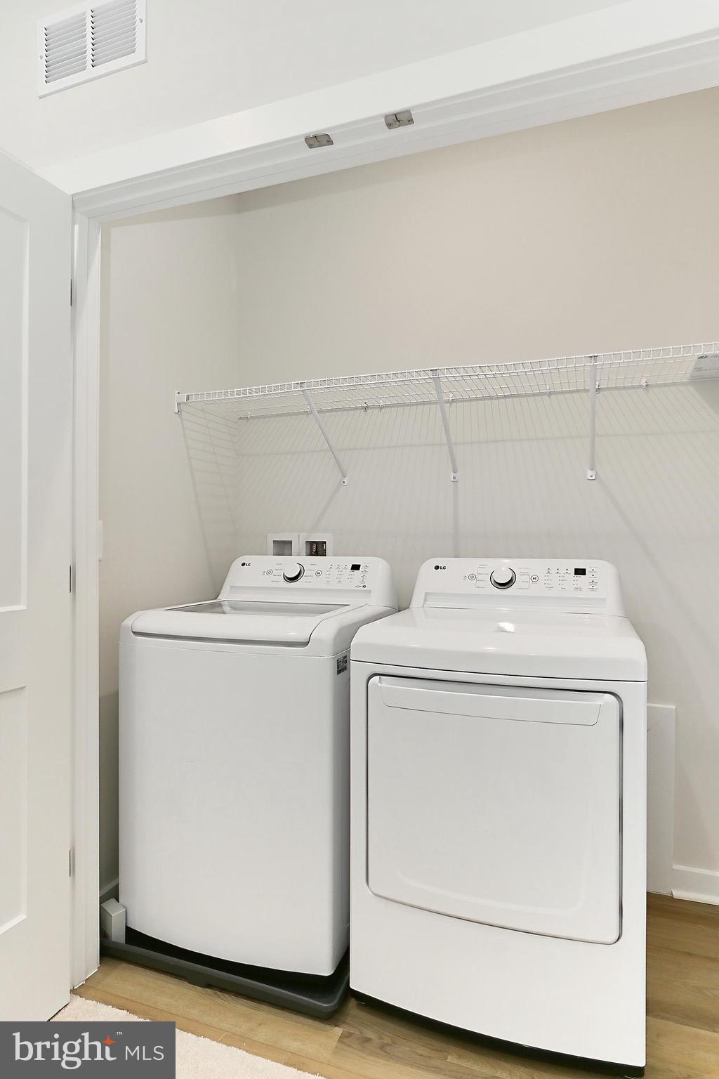 14176 Gypsum Loop Chantilly, VA 20151 - Photo 40 of 44 a utility room with dryer and washer