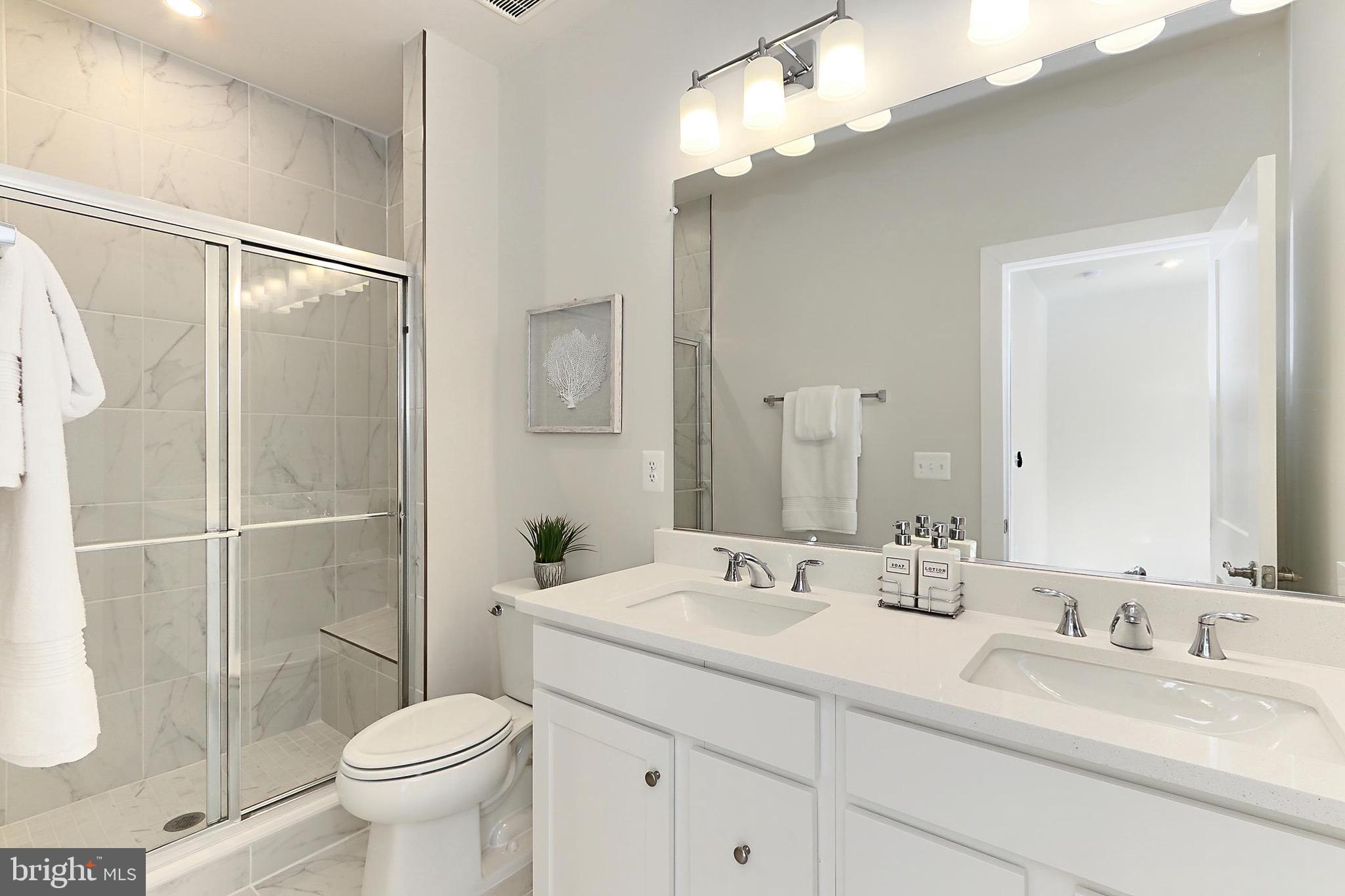 14176 Gypsum Loop Chantilly, VA 20151 - Photo 5 of 44 a bathroom with a double vanity sink mirror and toilet