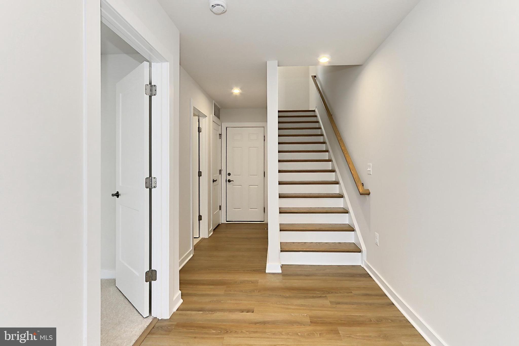 14176 Gypsum Loop Chantilly, VA 20151 - Photo 10 of 44 a view of a hallway with wooden floor and entryway