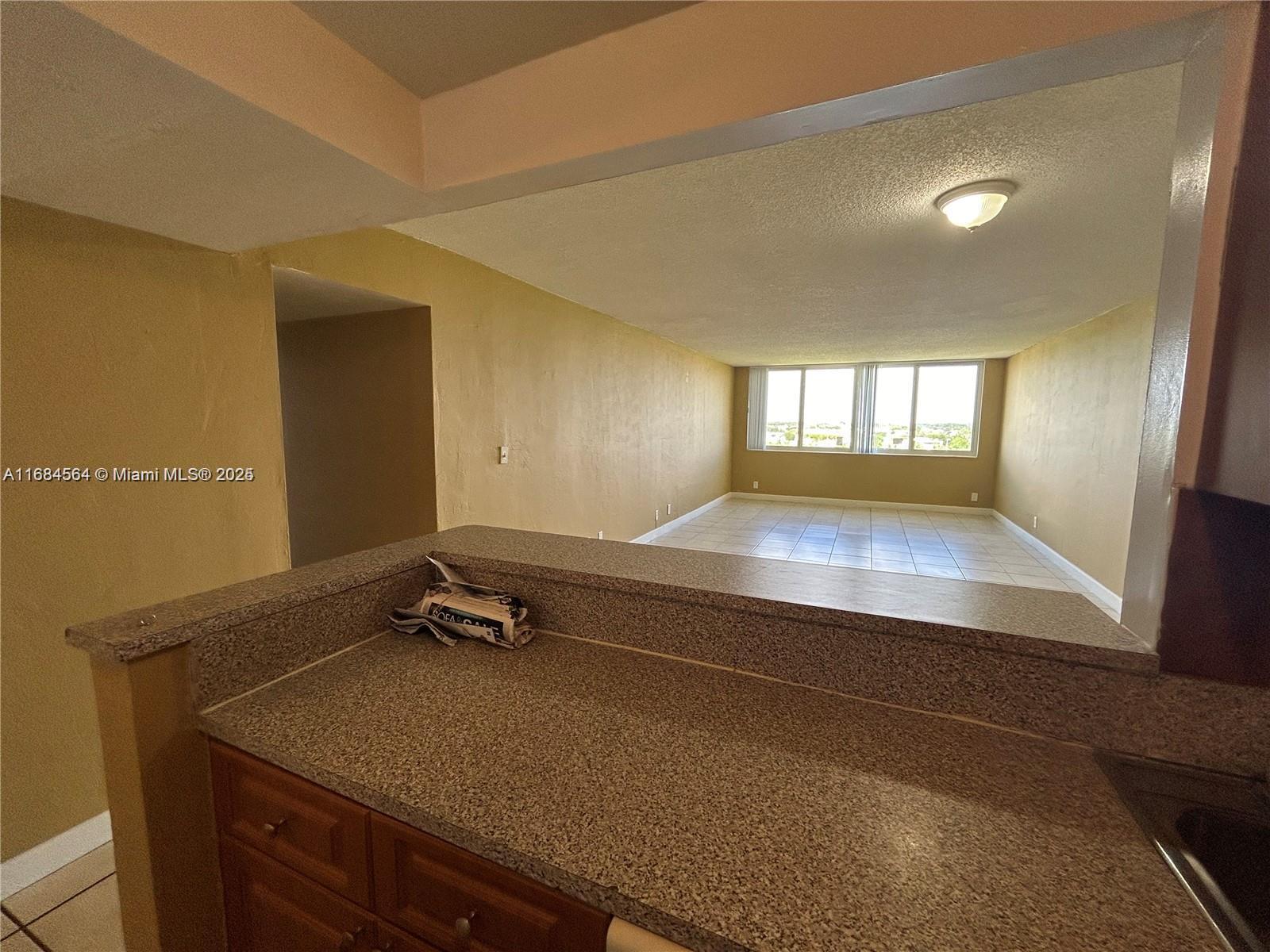 9143 Southwest 77th Avenue, Unit B802 Miami, FL 33156 - Photo 2 of 12 a room with pool table and windows