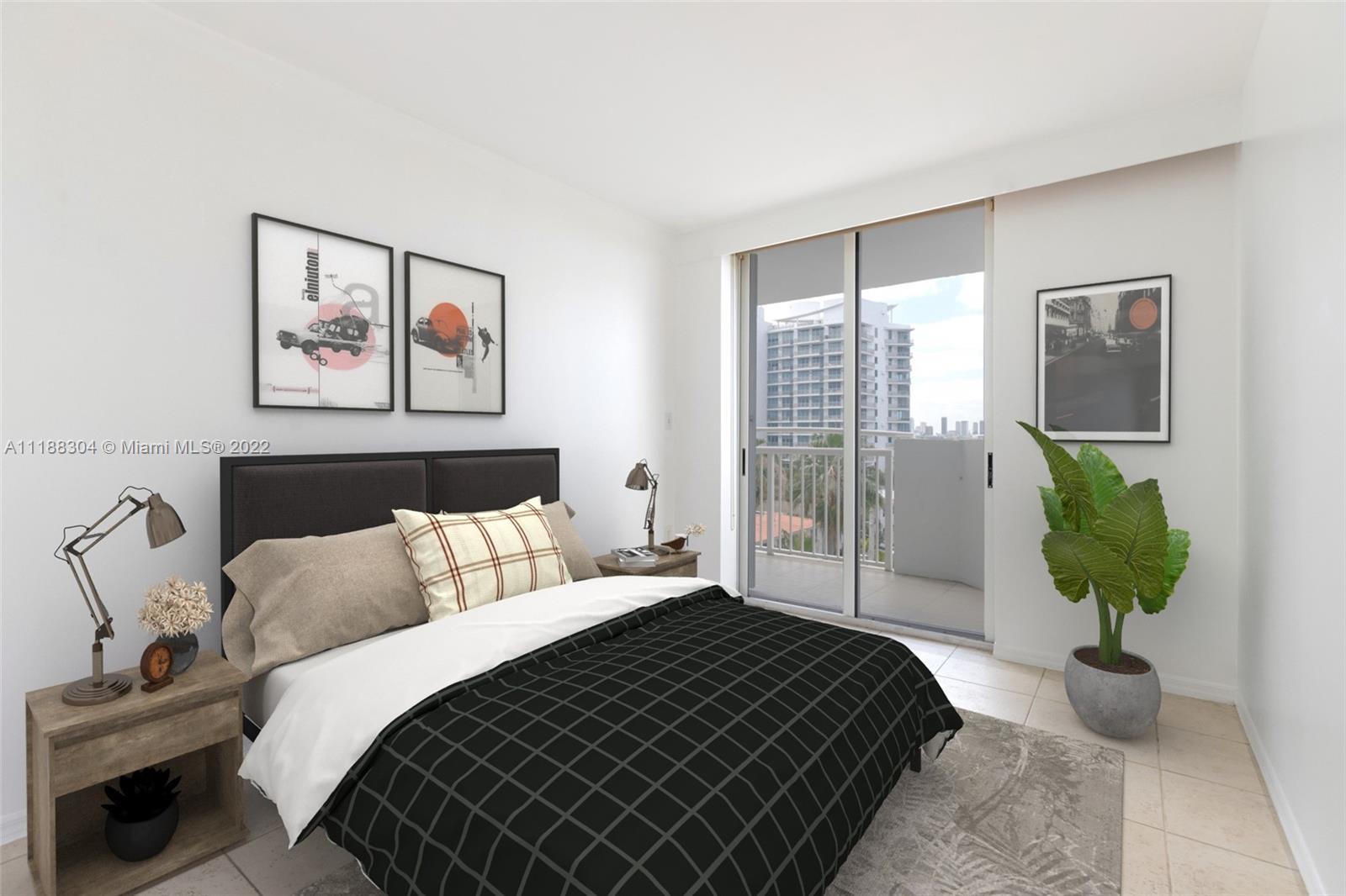 1621 Bay Road, Unit 602 Miami Beach, FL 33139 - Photo 12 of 28 a bedroom with bed and glass window