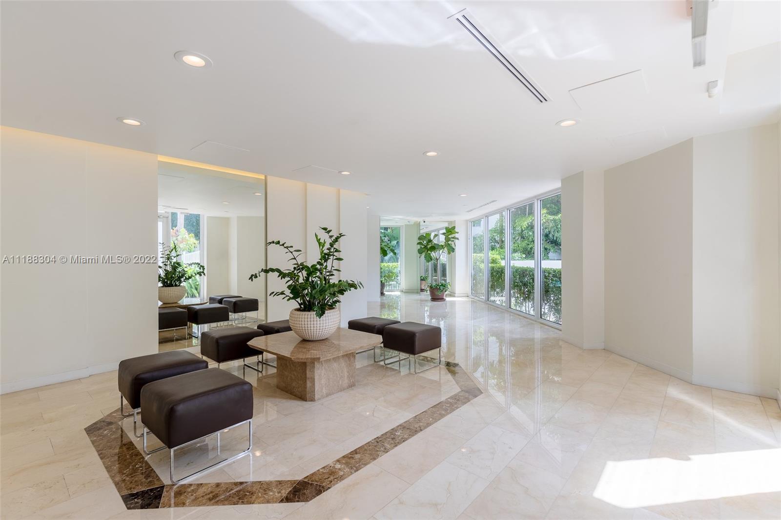 1621 Bay Road, Unit 602 Miami Beach, FL 33139 - Photo 17 of 28 a living room with furniture and a potted plant