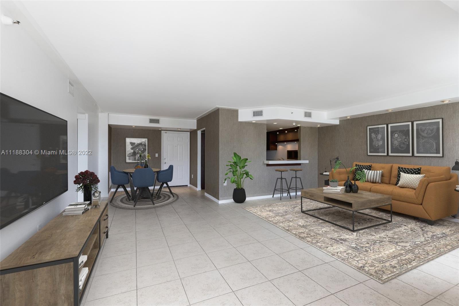 1621 Bay Road, Unit 602 Miami Beach, FL 33139 - Photo 3 of 28 a living room with furniture and a flat screen tv