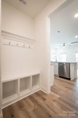 a view of a kitchen with wooden floor