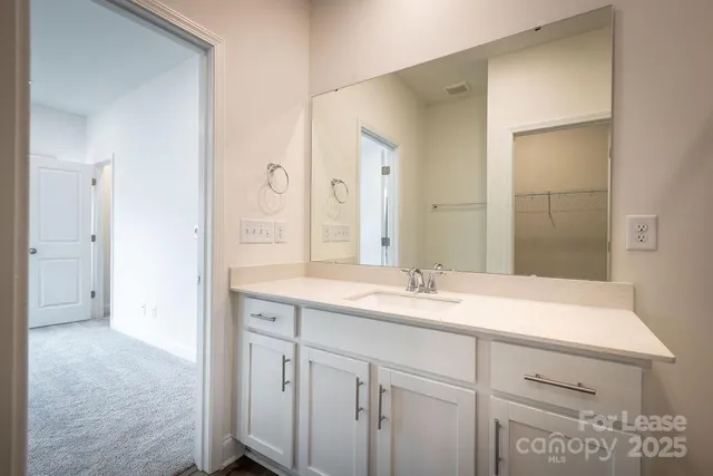 a view of a bathroom from a hallway