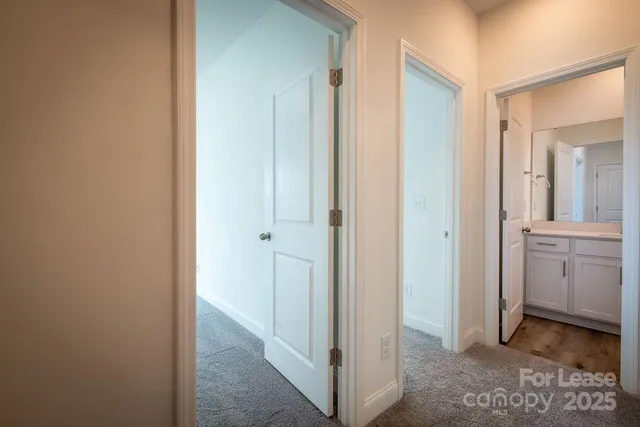 a bathroom with a granite countertop sink toilet a large mirror a bathtub and shower