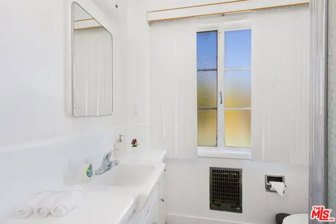 a bathroom with a sink and a bathtub
