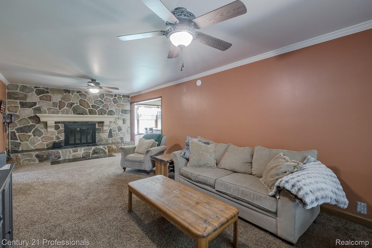 1790 Kent Road Ortonville, MI 48462 - Photo 22 of 64 Stone-clad fireplace with a hearth and mantle