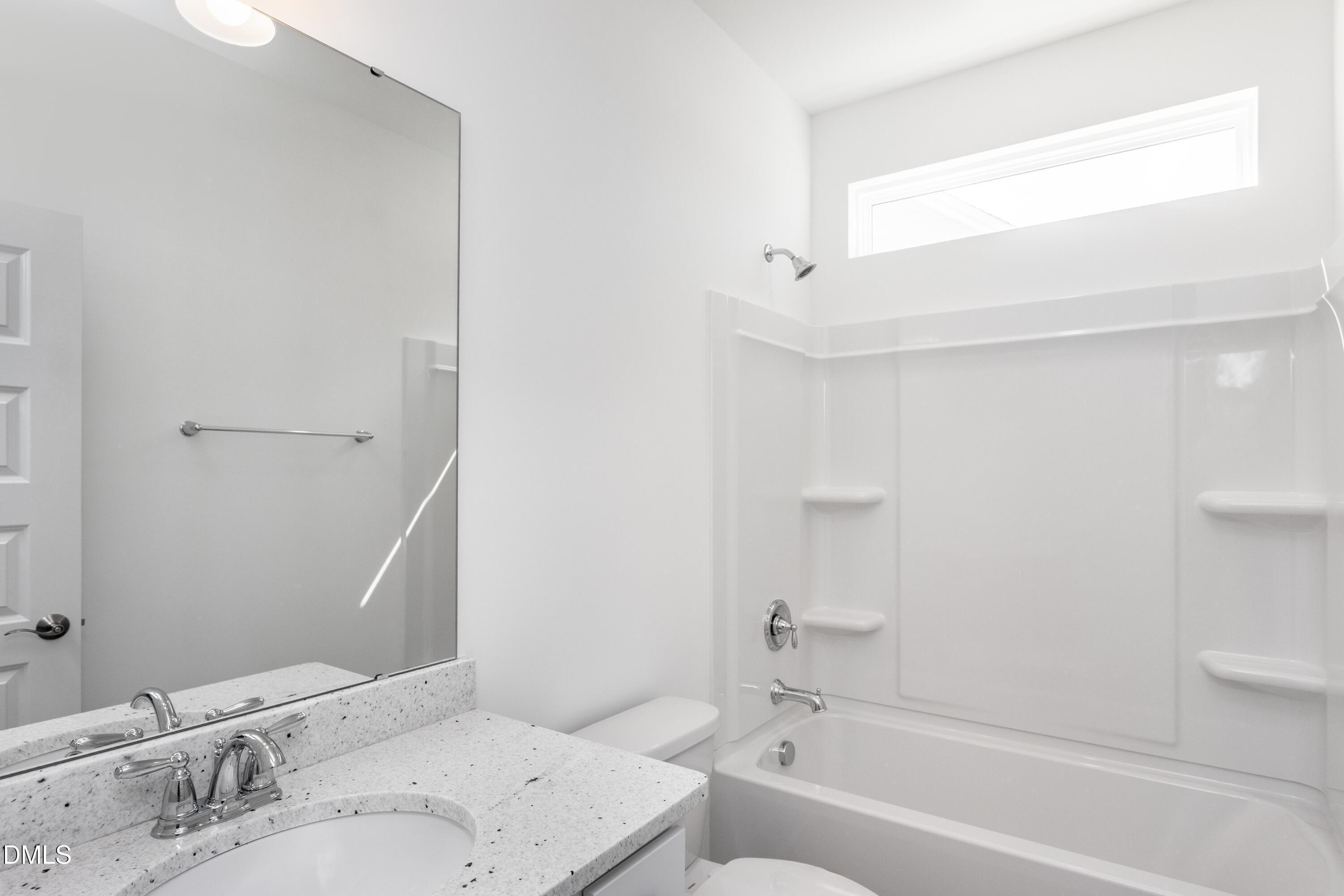 70 Slippery Elm Road Youngsville, NC 27596 - Photo 21 of 32 a bathroom with a bathtub and a sink
