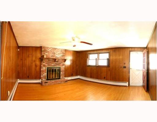 11 Stratford Road Seekonk, MA 02771 - Photo 3 of 9 Living Room. Large Living Room with Hardwoods and Gas Fireplace!
