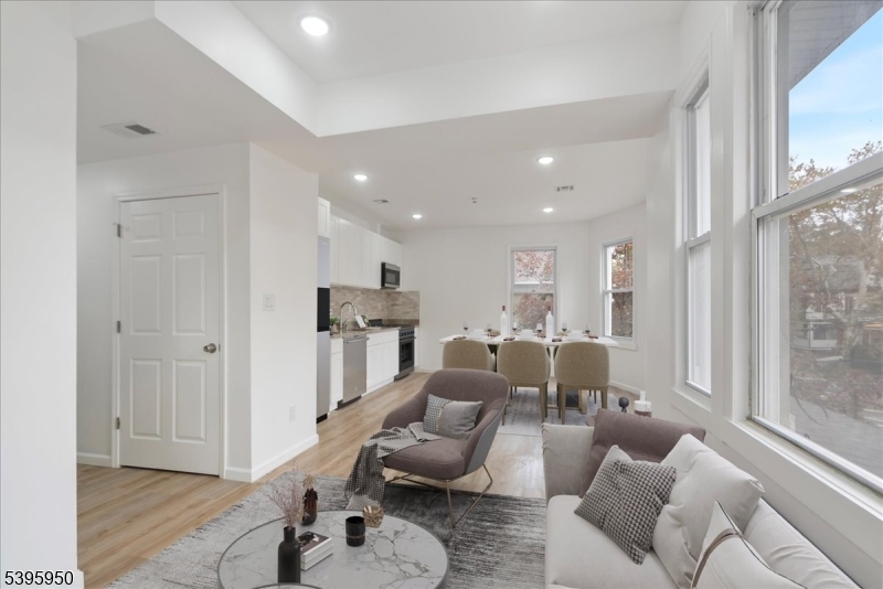 813 South 12th Street Newark, NJ 07108 - Photo 2 of 14 a living room with furniture and a large window