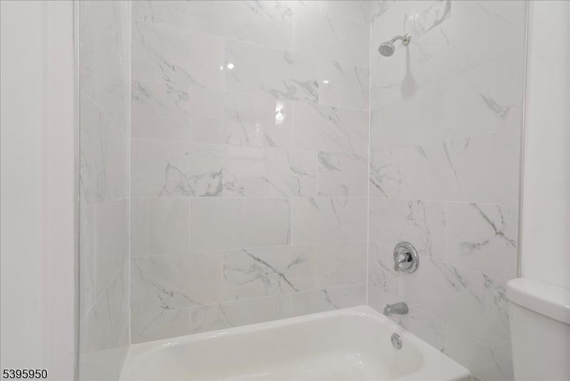 813 South 12th Street Newark, NJ 07108 - Photo 7 of 14 a bathroom with a bathtub