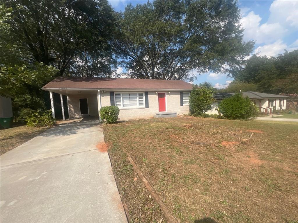 3156 Bluebird Lane Decatur, GA 30032 - Photo 1 of 1 front view of house with a yard