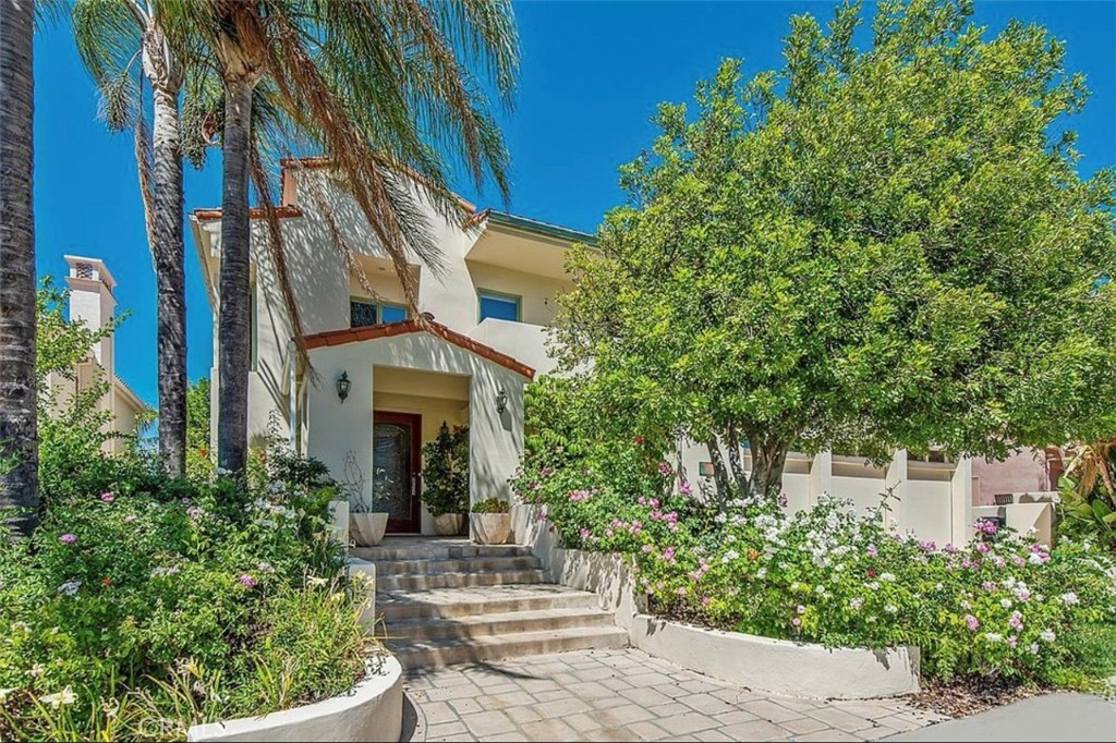 front view of a house with a garden