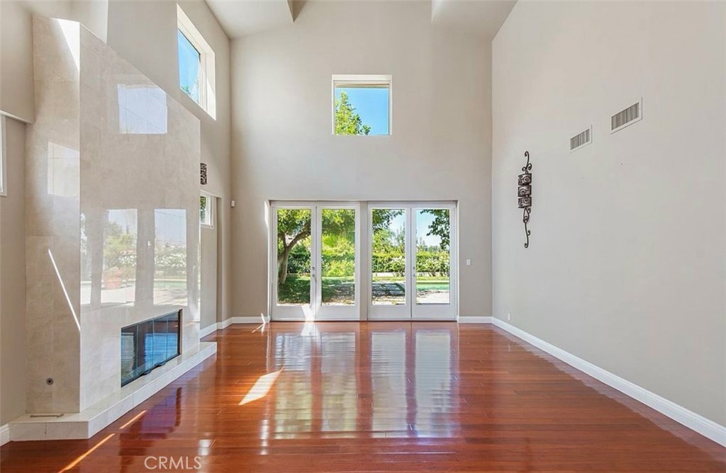 24907 Marbella Court Calabasas, CA 91302 - Photo 11 of 34 a view of empty room with wooden floor and fan