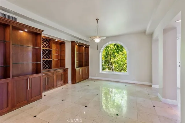 a view of an empty room with glass door
