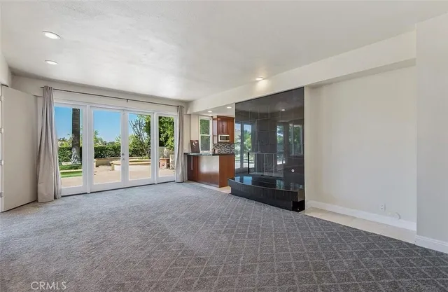 a view of kitchen with cabinets and outdoor space