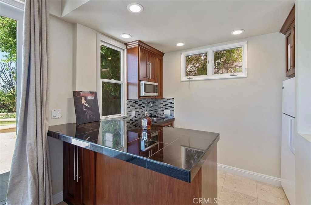 24907 Marbella Court Calabasas, CA 91302 - Photo 16 of 34 a view of kitchen with cabinets and outdoor space