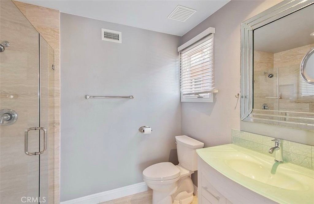 24907 Marbella Court Calabasas, CA 91302 - Photo 19 of 34 a bathroom with a sink toilet and shower