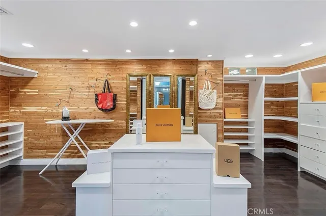 a view of a kitchen with a sink and wooden floor