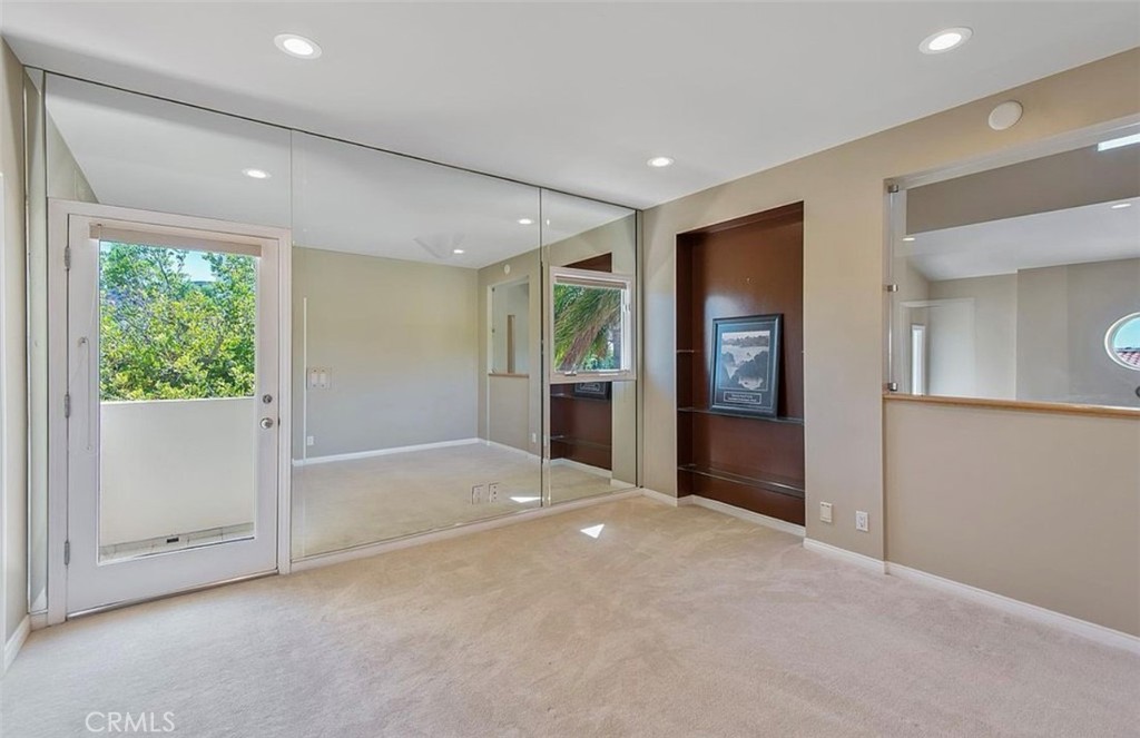 24907 Marbella Court Calabasas, CA 91302 - Photo 30 of 34 a view of an empty room with wooden floor and a window