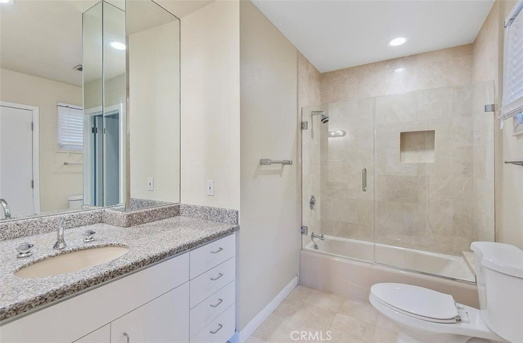 24907 Marbella Court Calabasas, CA 91302 - Photo 31 of 34 a bathroom with a granite countertop sink toilet and shower