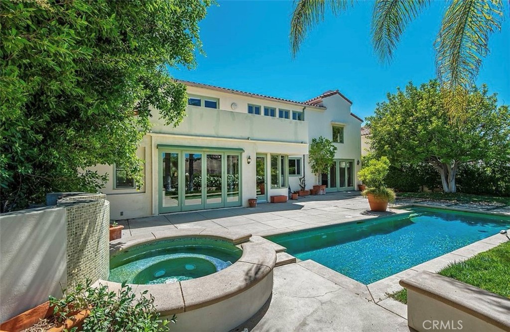 24907 Marbella Court Calabasas, CA 91302 - Photo 5 of 34 a view of a house with backyard sitting area and swimming pool
